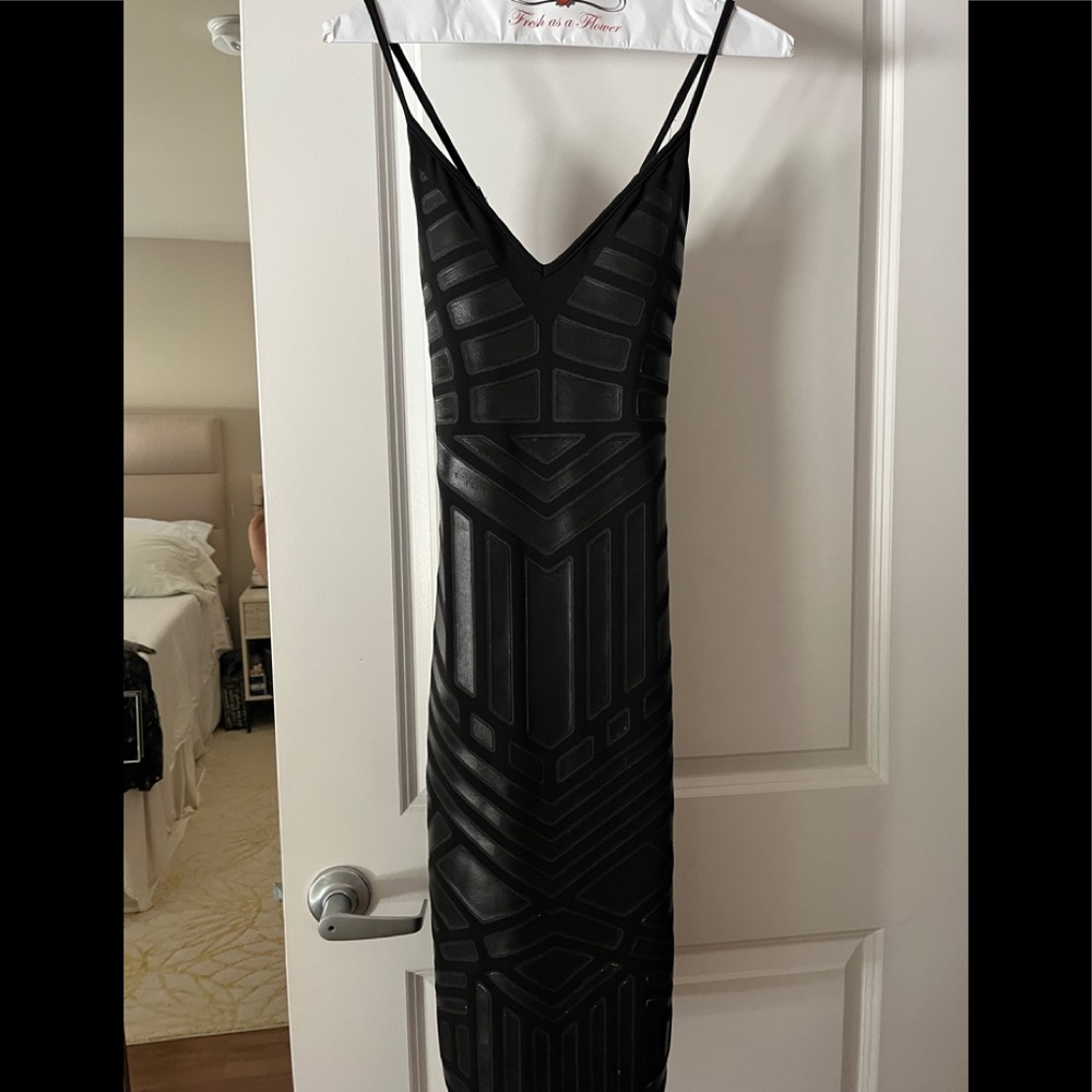 From Hondarribia, Spain gorgeous, never worn, form-fitting, sexy black dress.